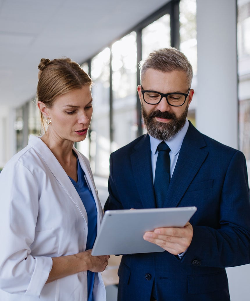 Man and woman discussing paperwork