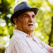 Elderly gentleman wearing a hat outdoors