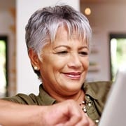 Older woman looking at paper